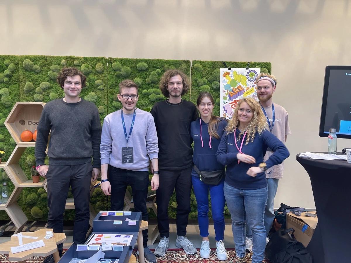 A group of 5 people from Dodonut team standing on the background 