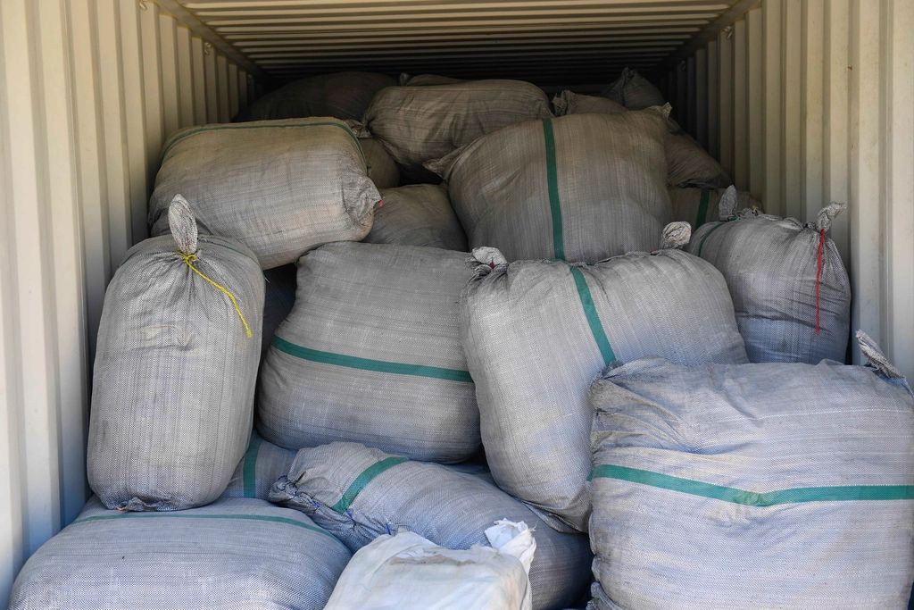 Relief supply sacks staged inside a shipping container