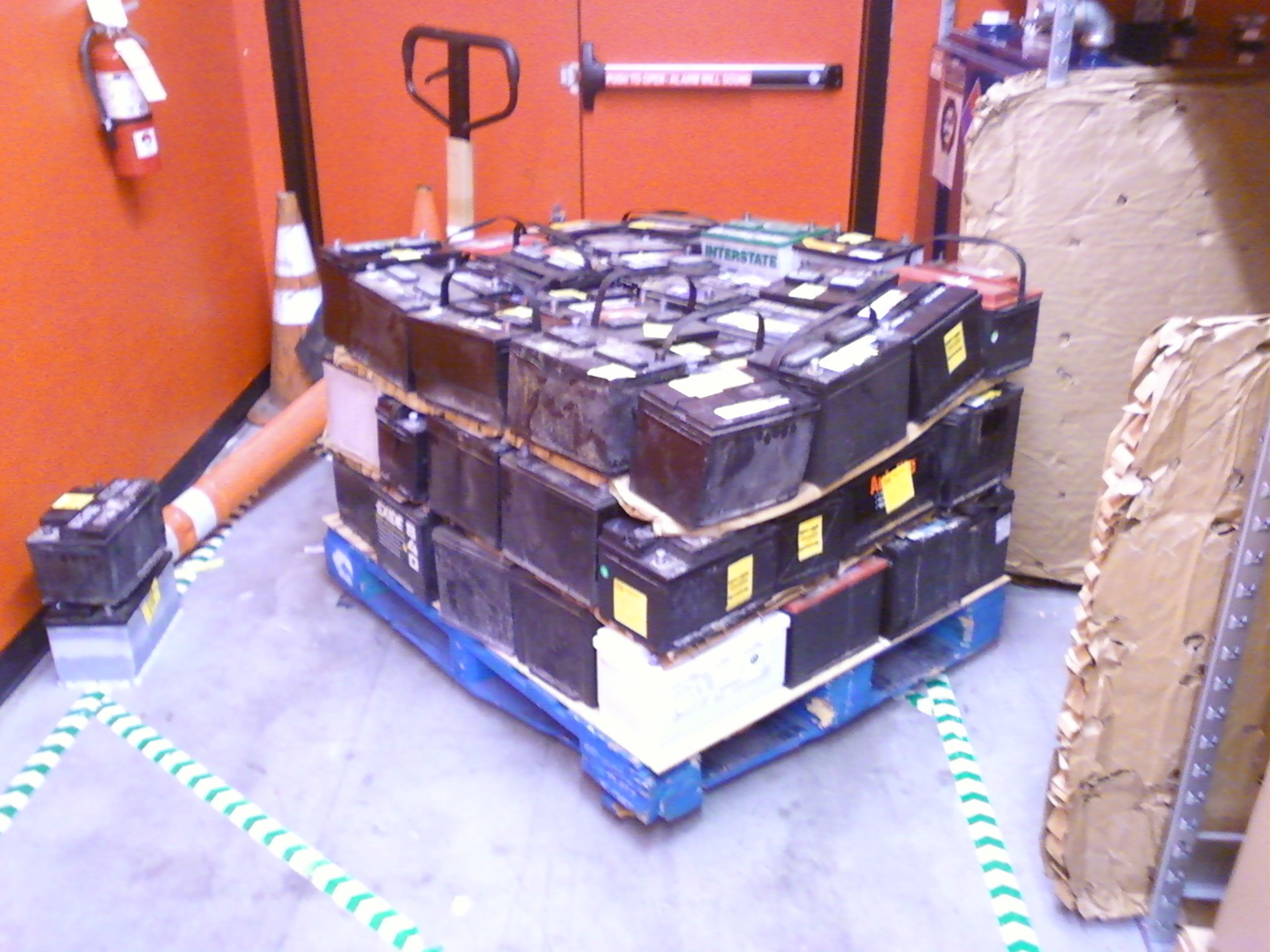 Shipping container being loaded onto a truck for transport