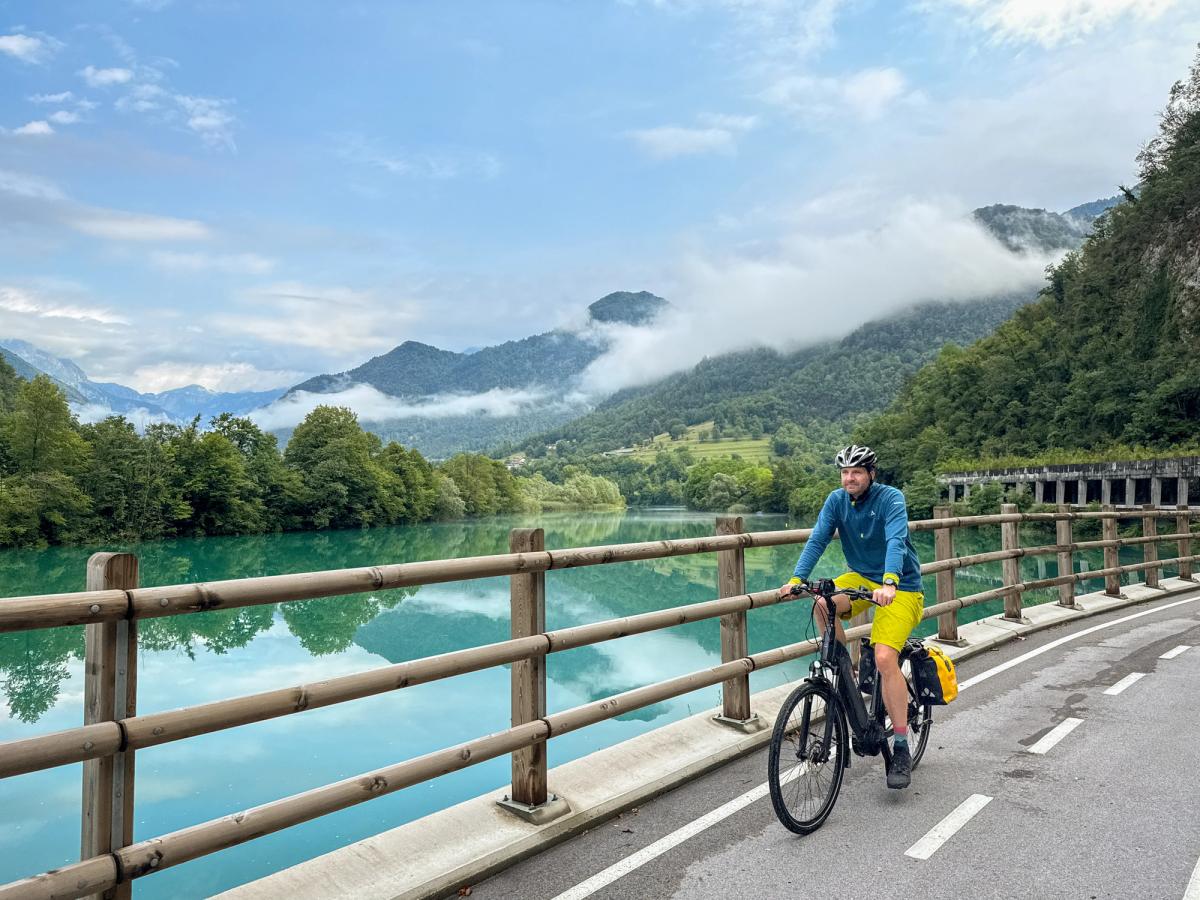 a moment of bicycle touring along a scenic route, likely in Slovenia, given the reference to cycling routes along Slovenian waters