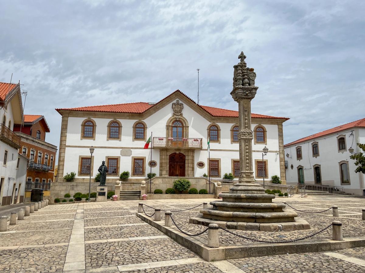 the City Hall building and the 16th-century Gothic Manueline style granite pillory in Vila Nova de Foz Côa, Portugal