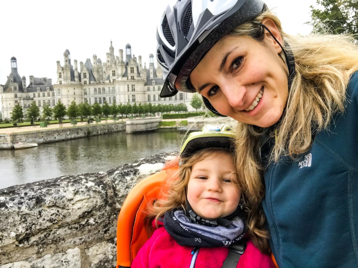 Happy family cycling in France
