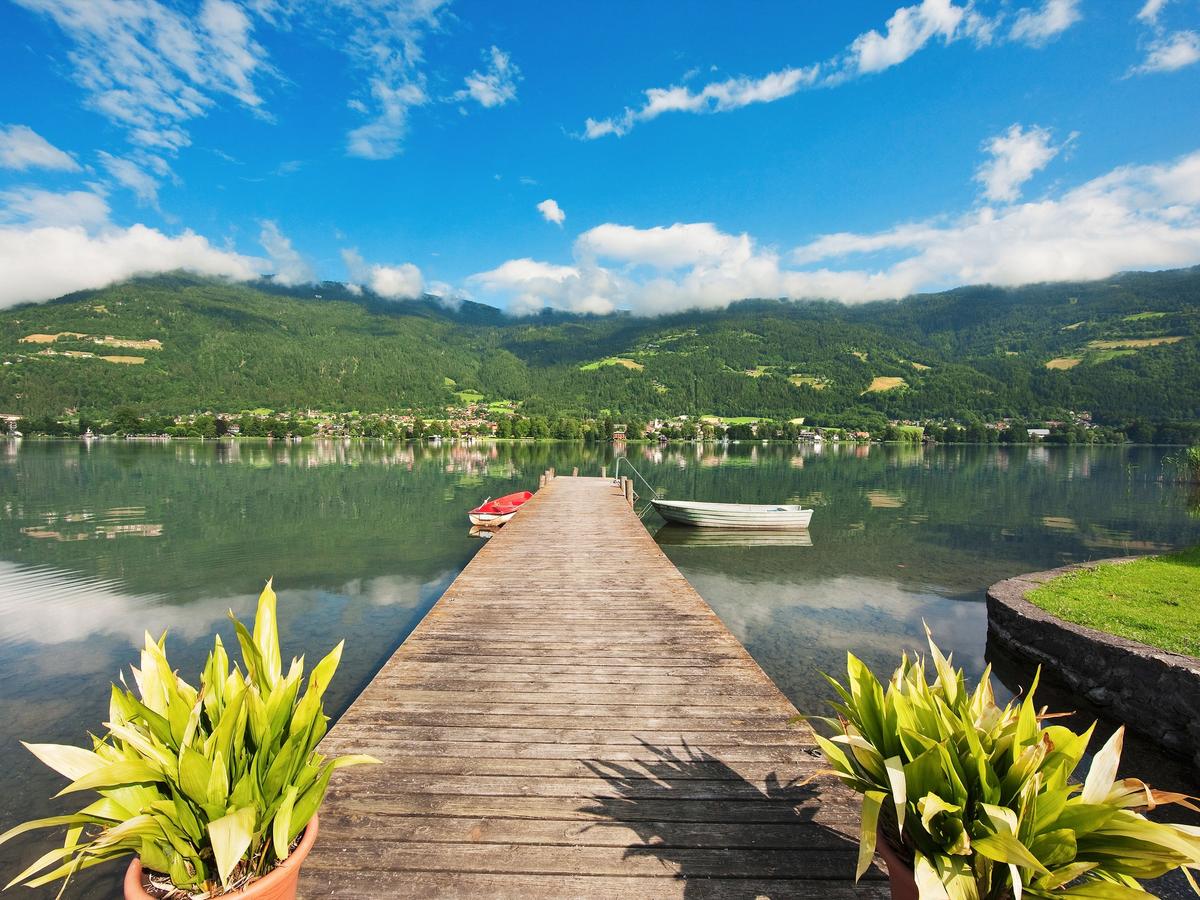 a scenic view of Lake Ossiach (Ossiacher See), a glacial lake in Carinthia, Austria