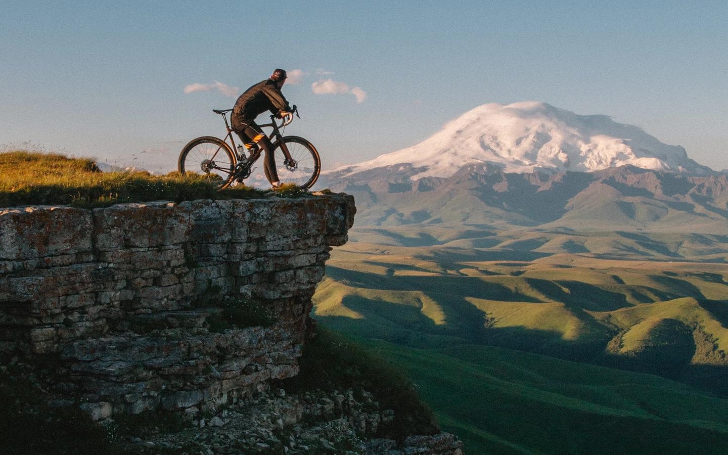 Cyclist admiring the view of the French Pyrenees 