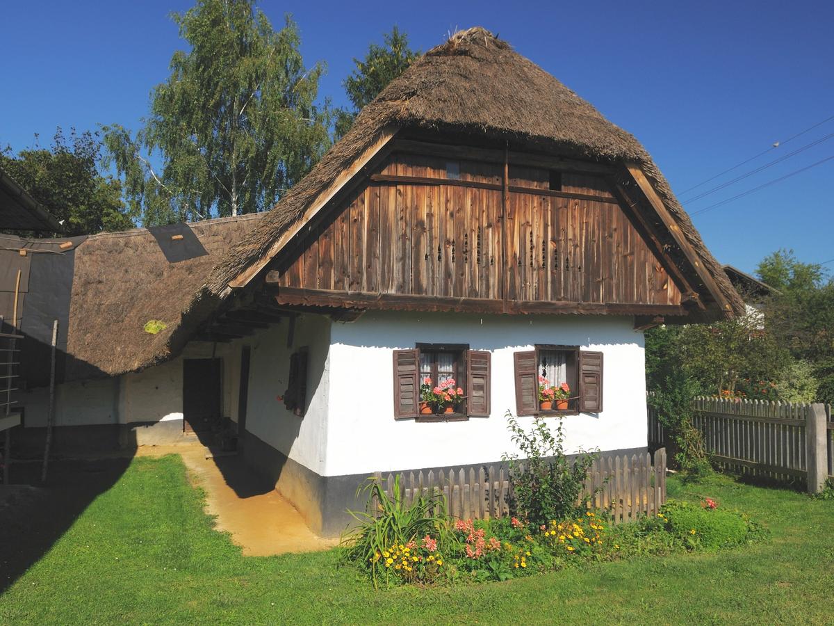 Magda's House, a preserved thatched-roof house in Filovci, Slovenia