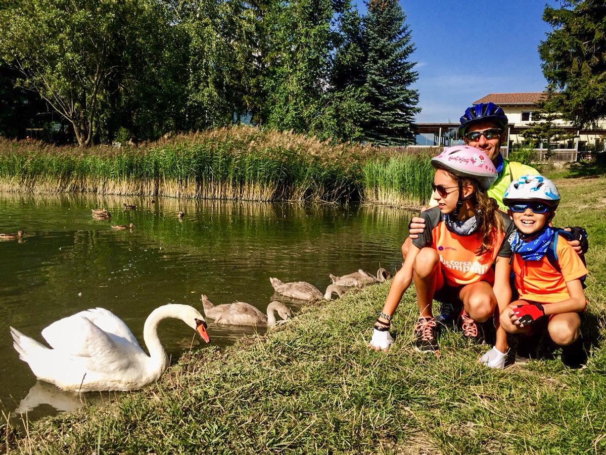 Family cycling in Italy