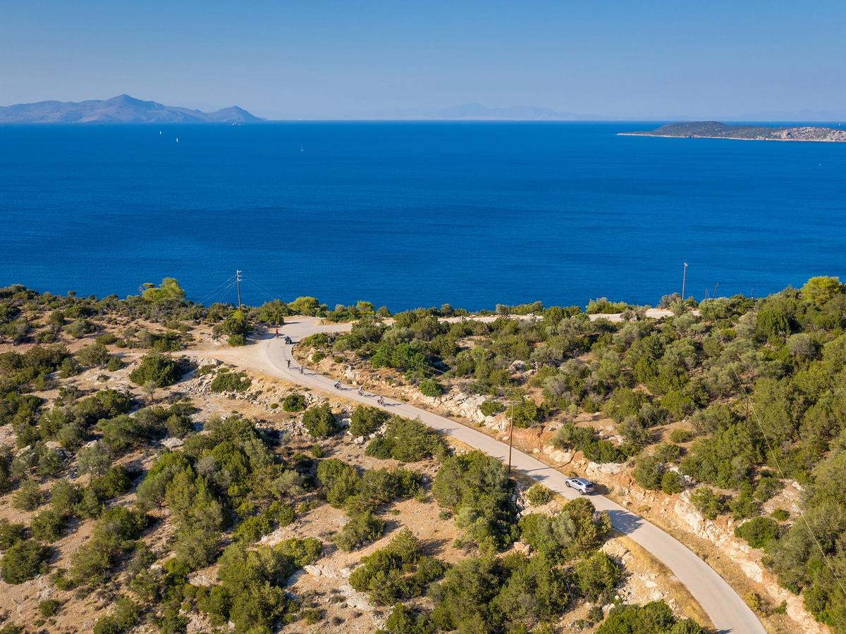 a coastal road in the Peloponnese region of Greece, overlooking the Saronic Gulf and its islands