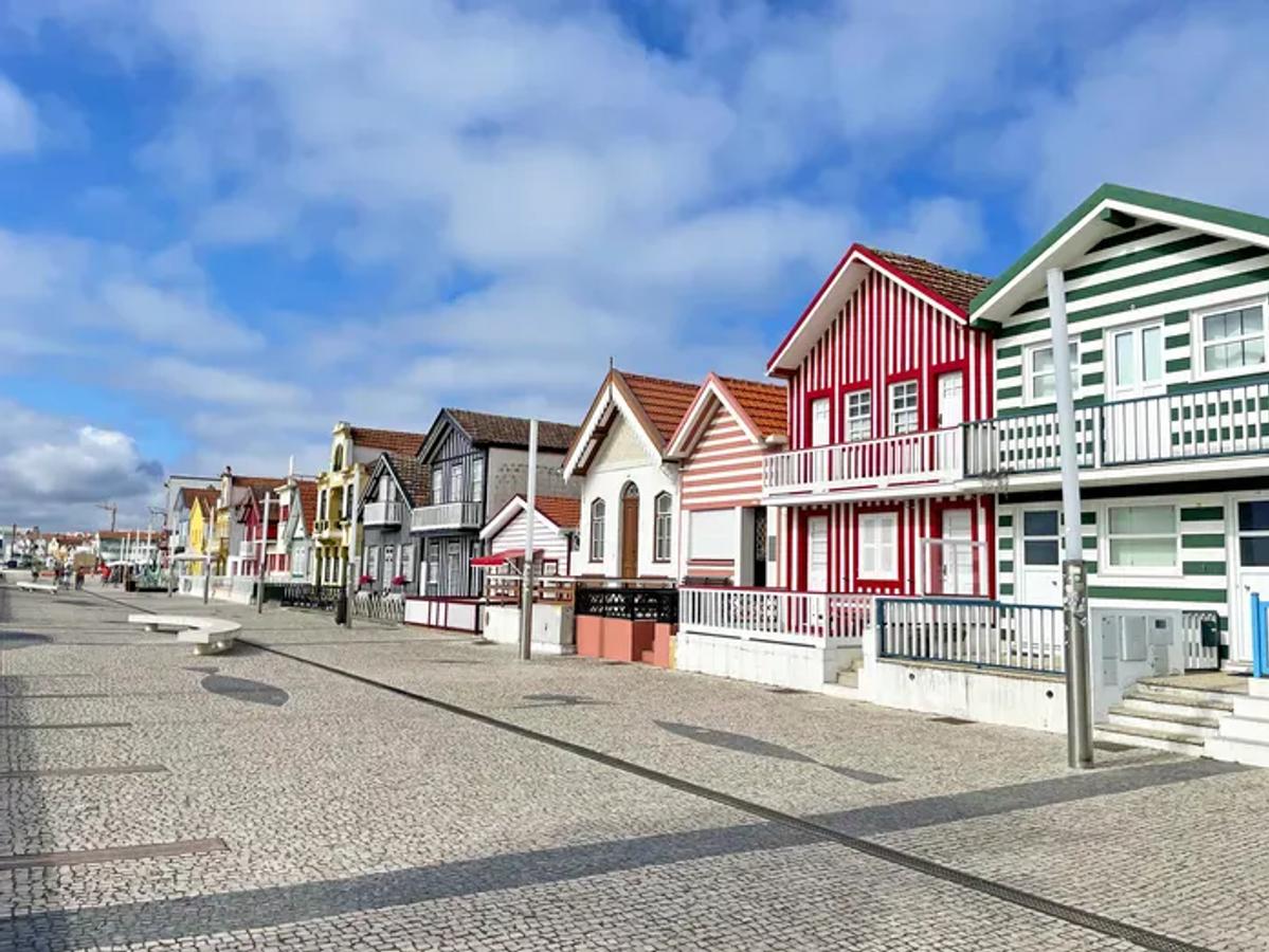 iconic striped houses, known as "palheiros," of Praia da Costa Nova in Portugal