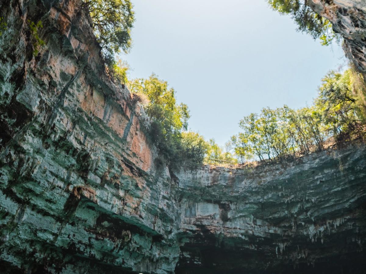Melissani Cave, a stunning underground lake and cave system located near Karavomilos on the island of Kefalonia, Greece
