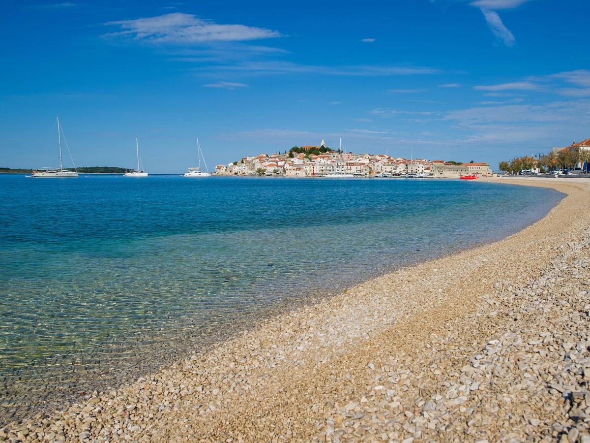Picturesque coastal town of Pakoštane, Croatia with beach and boats on the Adriatic Sea