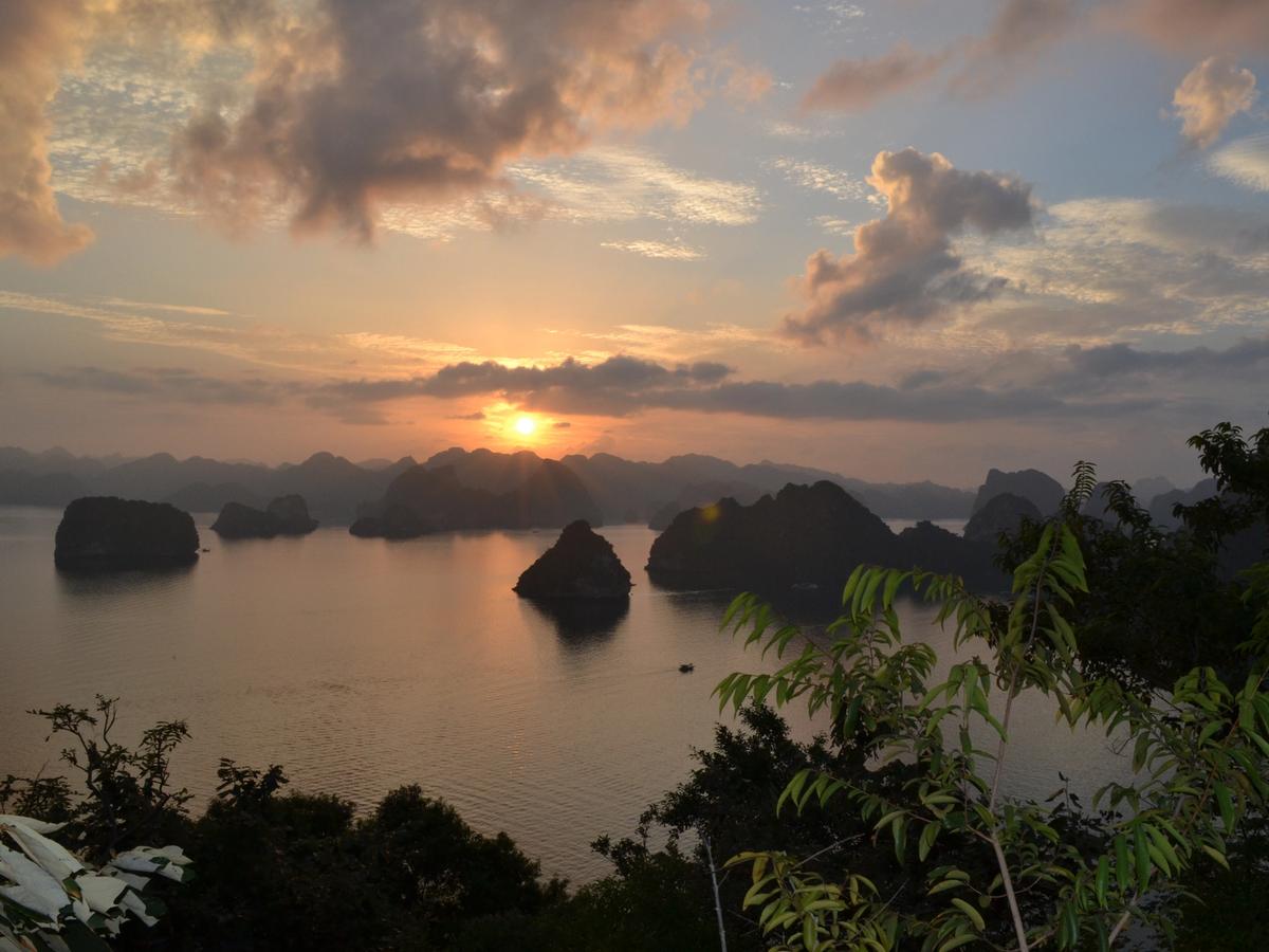 a sunset over Ha Long Bay (also written as Hạ Long Bay) in Vietnam