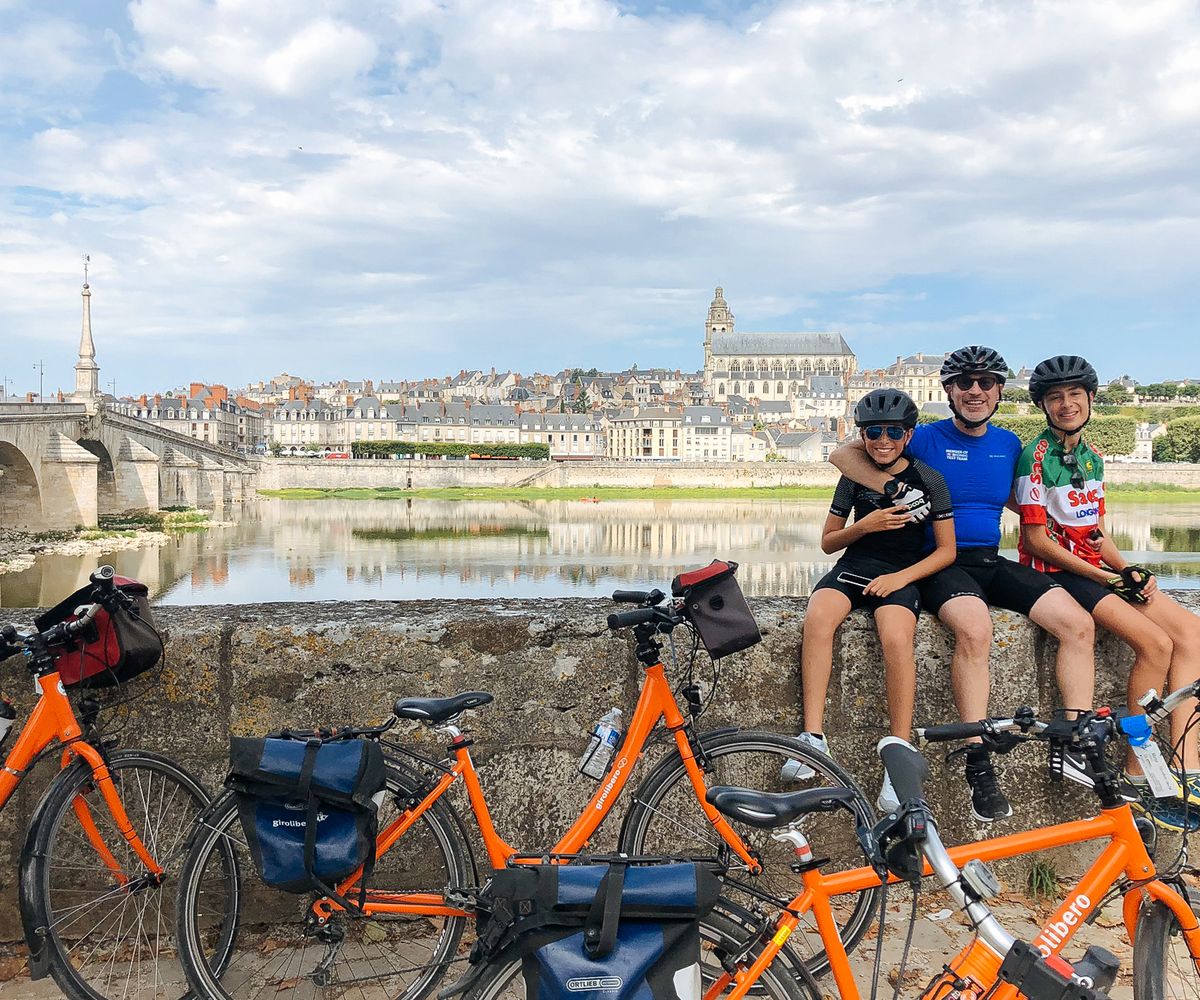 Family relaxing on their cycling holiday in France
