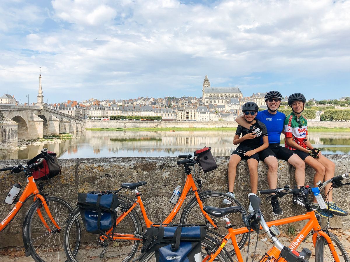 Family relaxing on their cycling holiday in France
