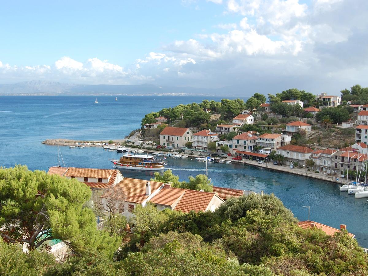 coastal town and clear blue waters in Kvarner Islands & National Parks of Croatia and Dalmatian Coast