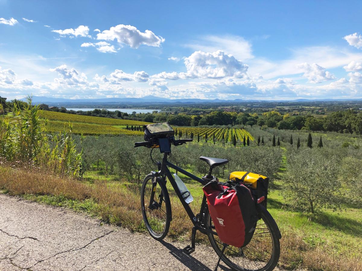 a moment during a cycling trip in the Umbria region of Italy, with Lake Trasimeno visible in the background