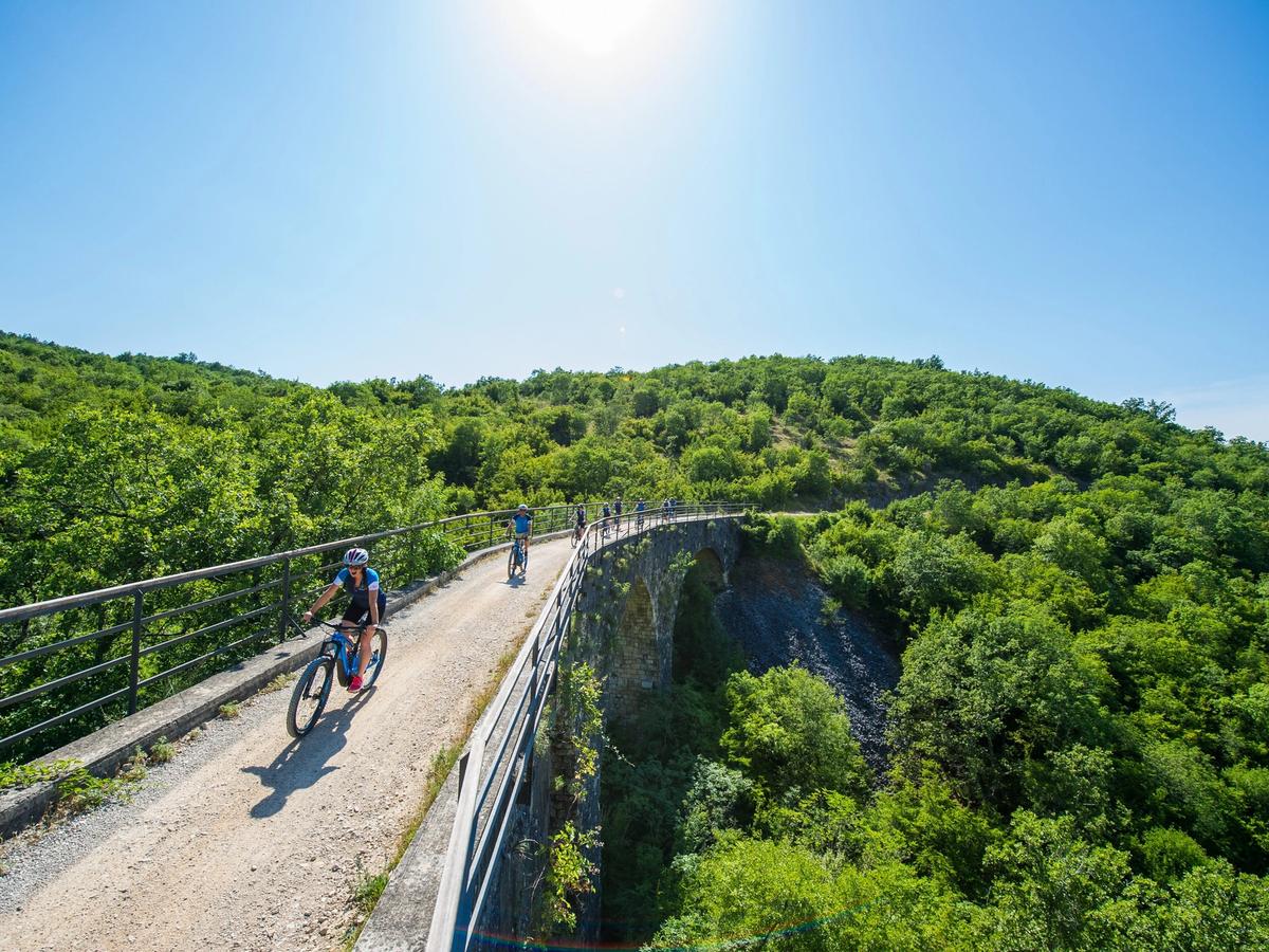 the Parenzana Trail, also known as the "Trail of Health and Friendship," a popular cycling and hiking route that follows a former narrow-gauge railway line through Italy, Slovenia, and Croatia