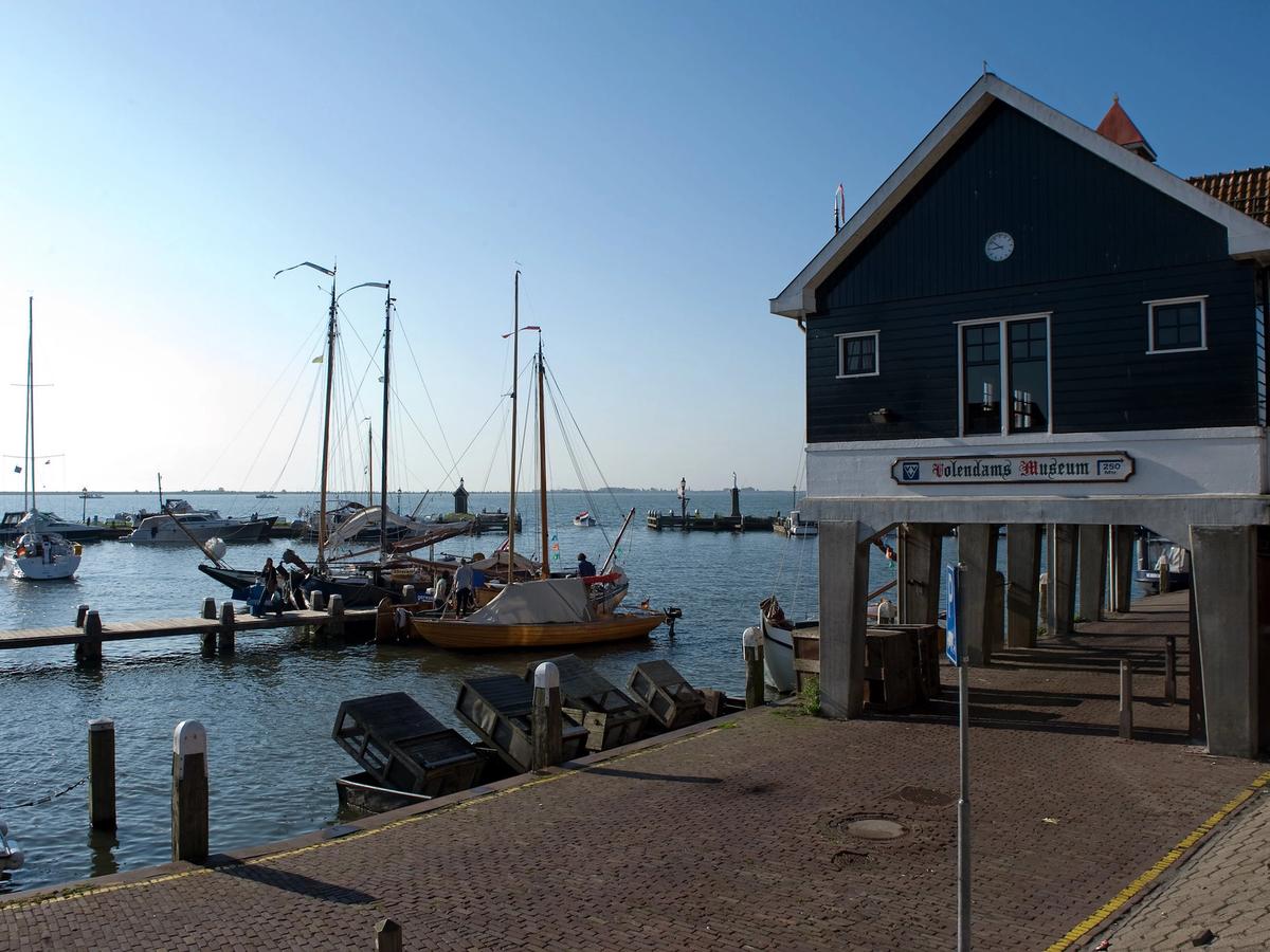 the harbor area of Volendam, a traditional fishing village in the Netherlands, located near Amsterdam