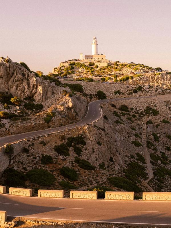 Road and lighthouse in Majorca, Spain