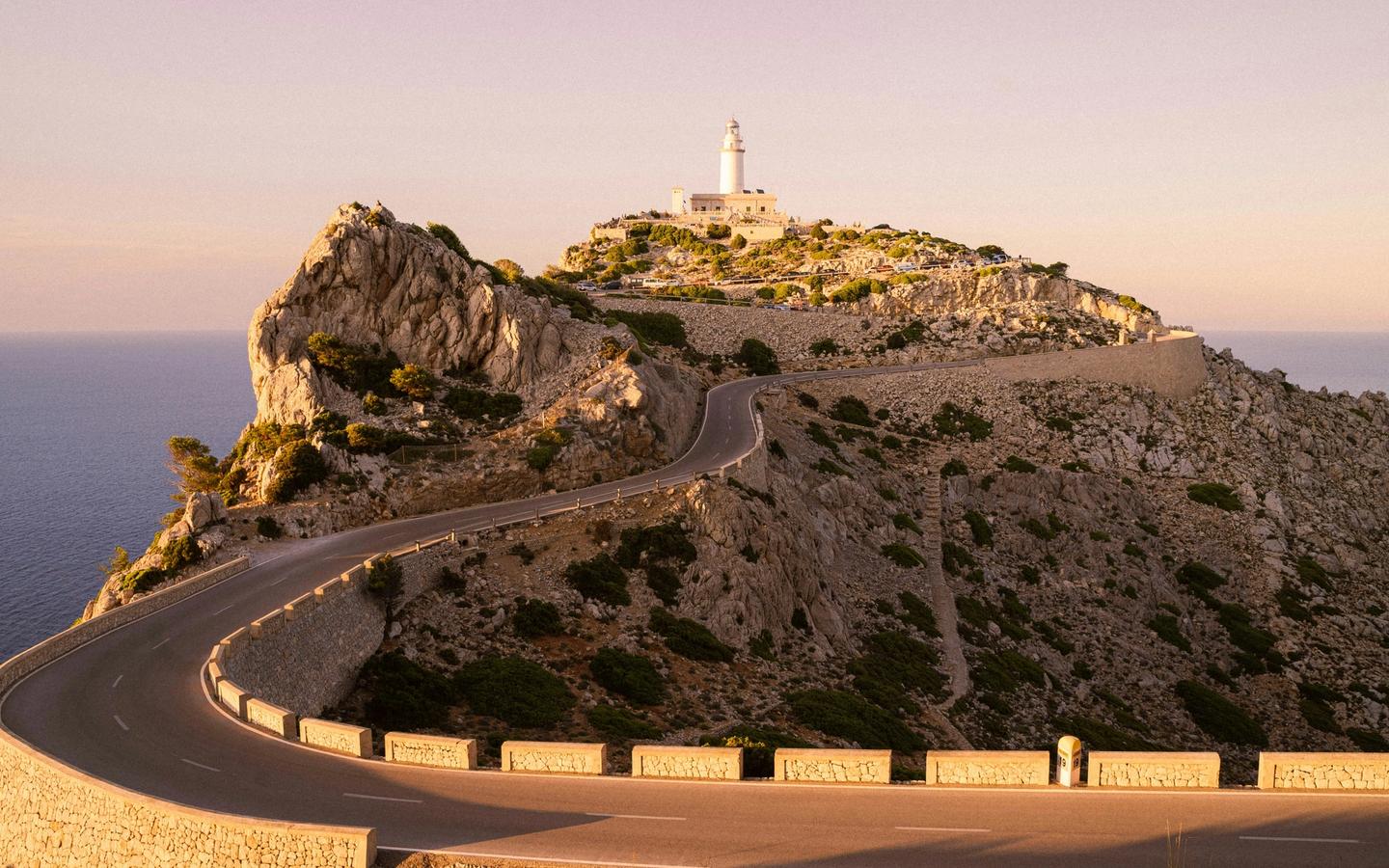 Road and lighthouse in Majorca, Spain