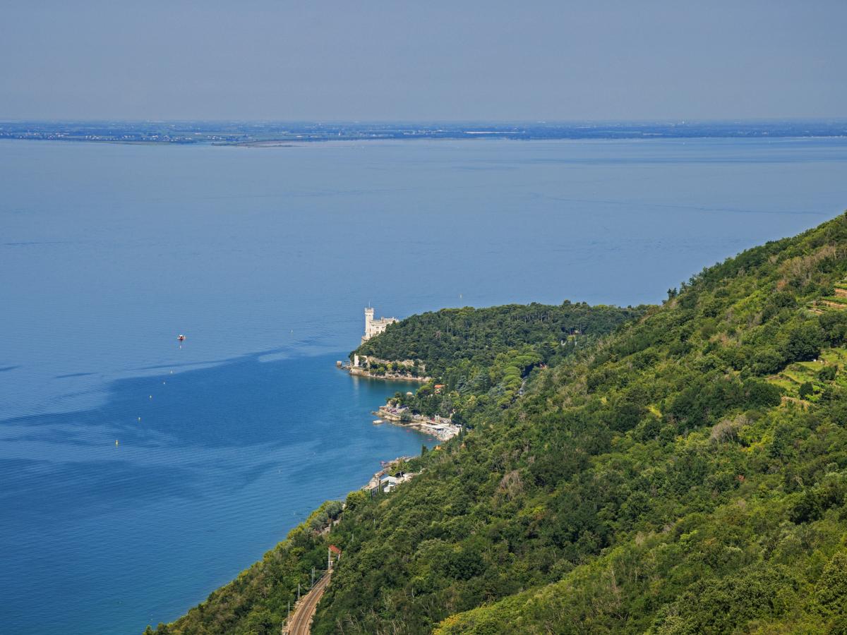 the Miramare Castle in Trieste, Italy, a 19th-century residence known for its stunning location overlooking the Gulf of Trieste