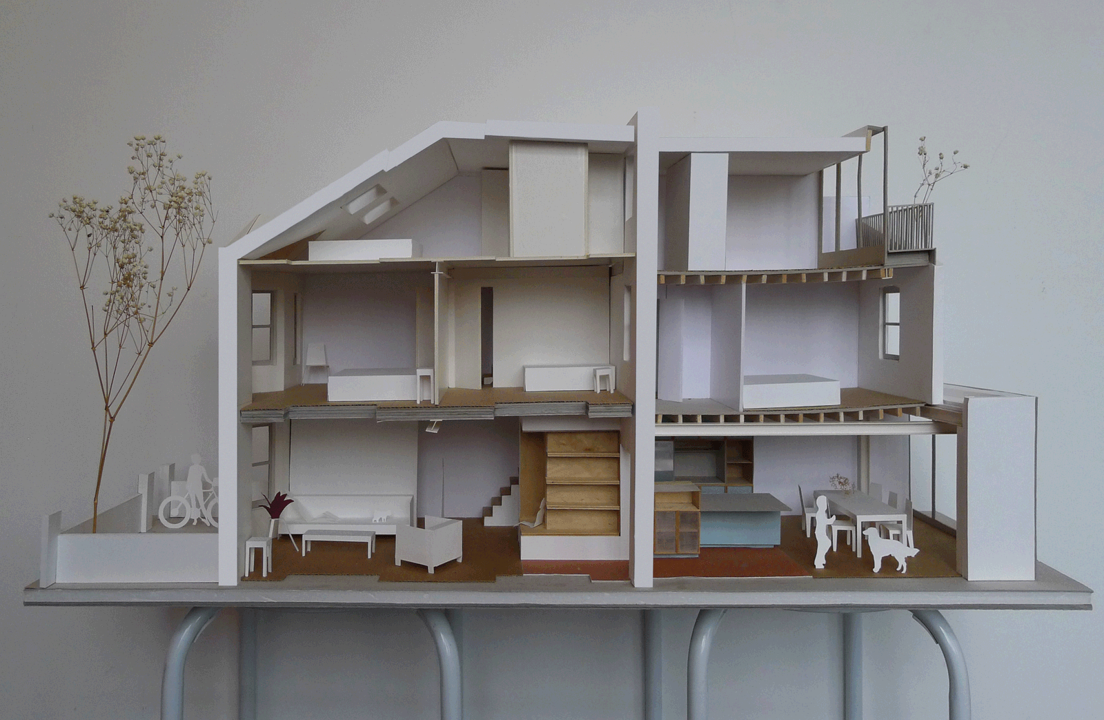 Sectional house model showing rooms, stair and roof lights