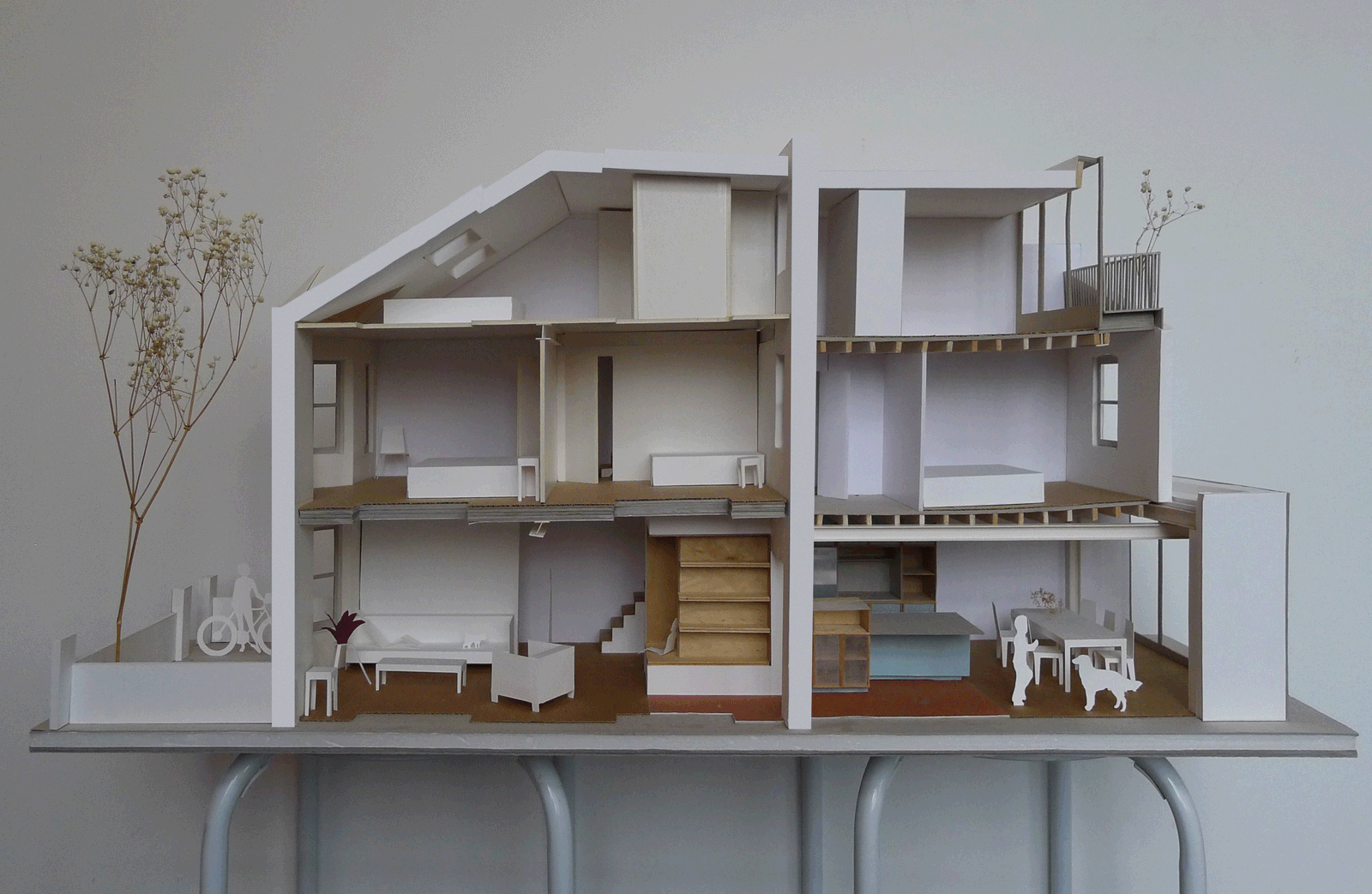 Sectional house model showing rooms, stair and roof lights