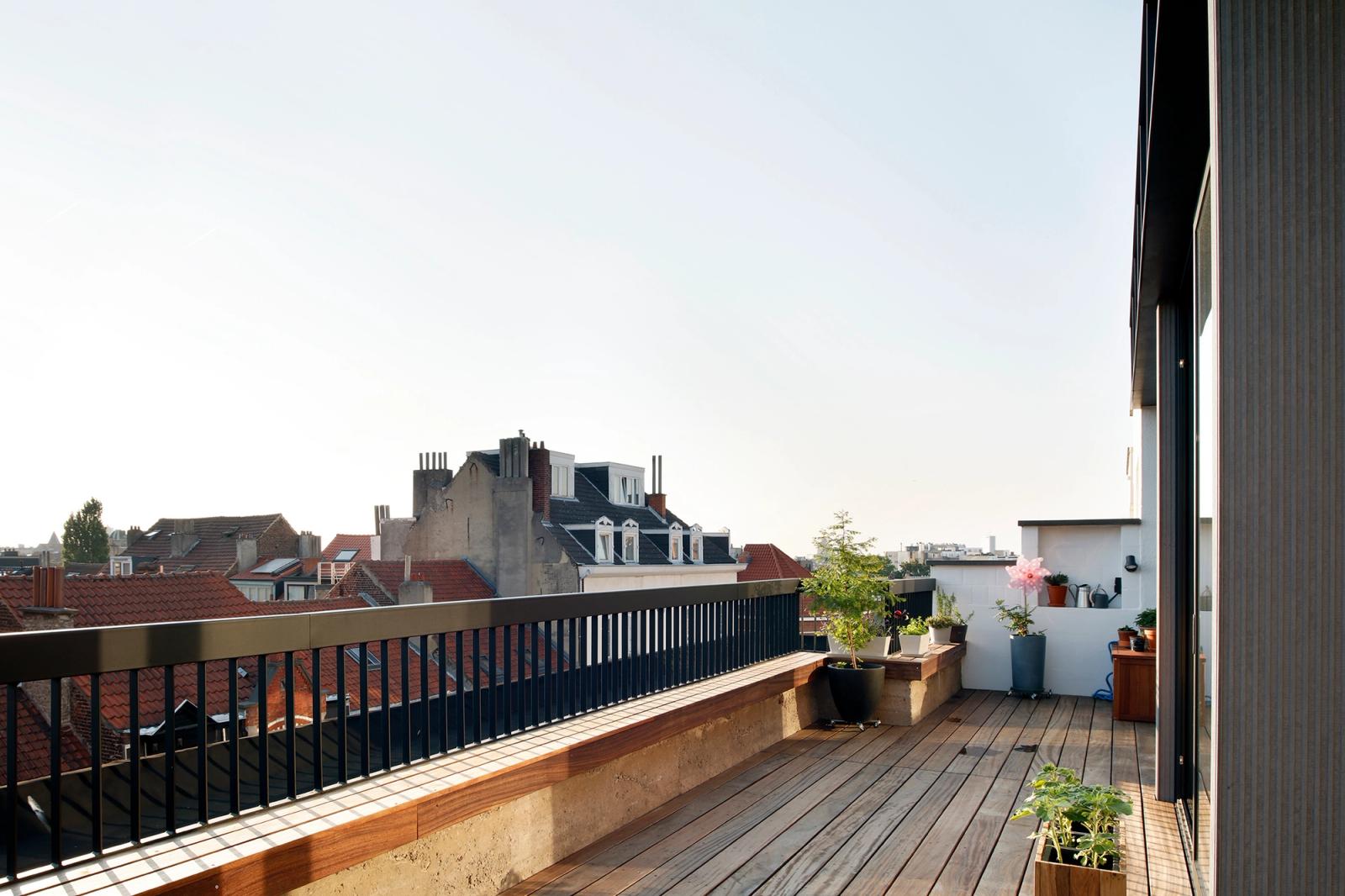 Long rooftop deck overlooking the surrounding city roofs