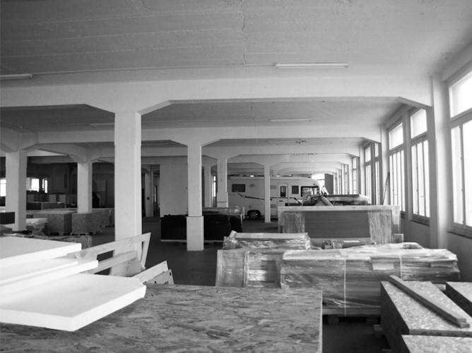 Existing open floor plate with concrete columns and long windows