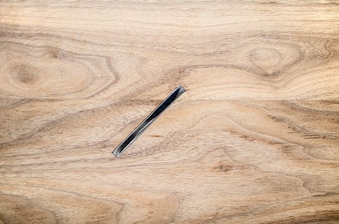 Close view of the timber tabletop and recessed dark fitting