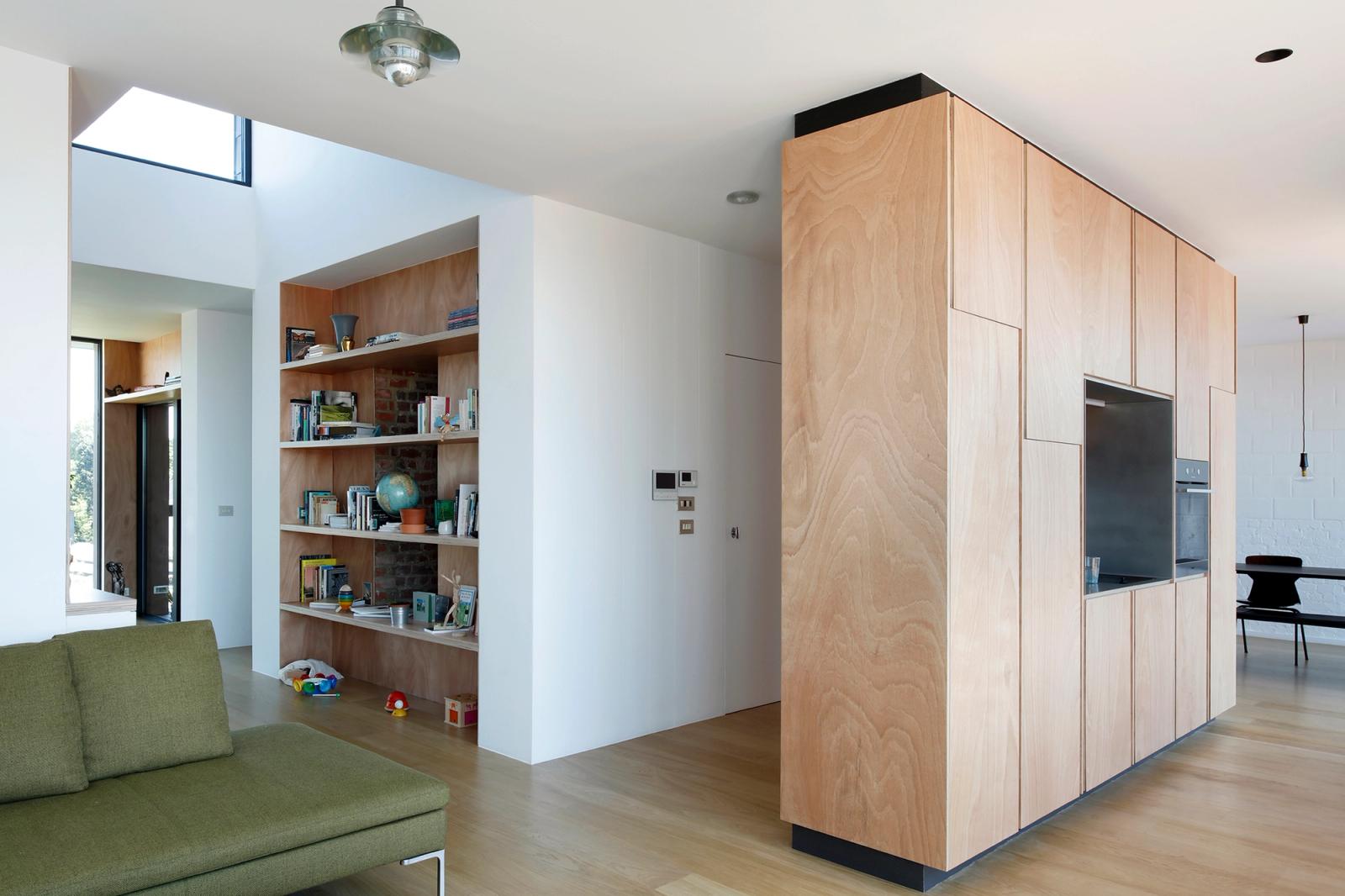 Freestanding timber kitchen cabinet dividing the open living room