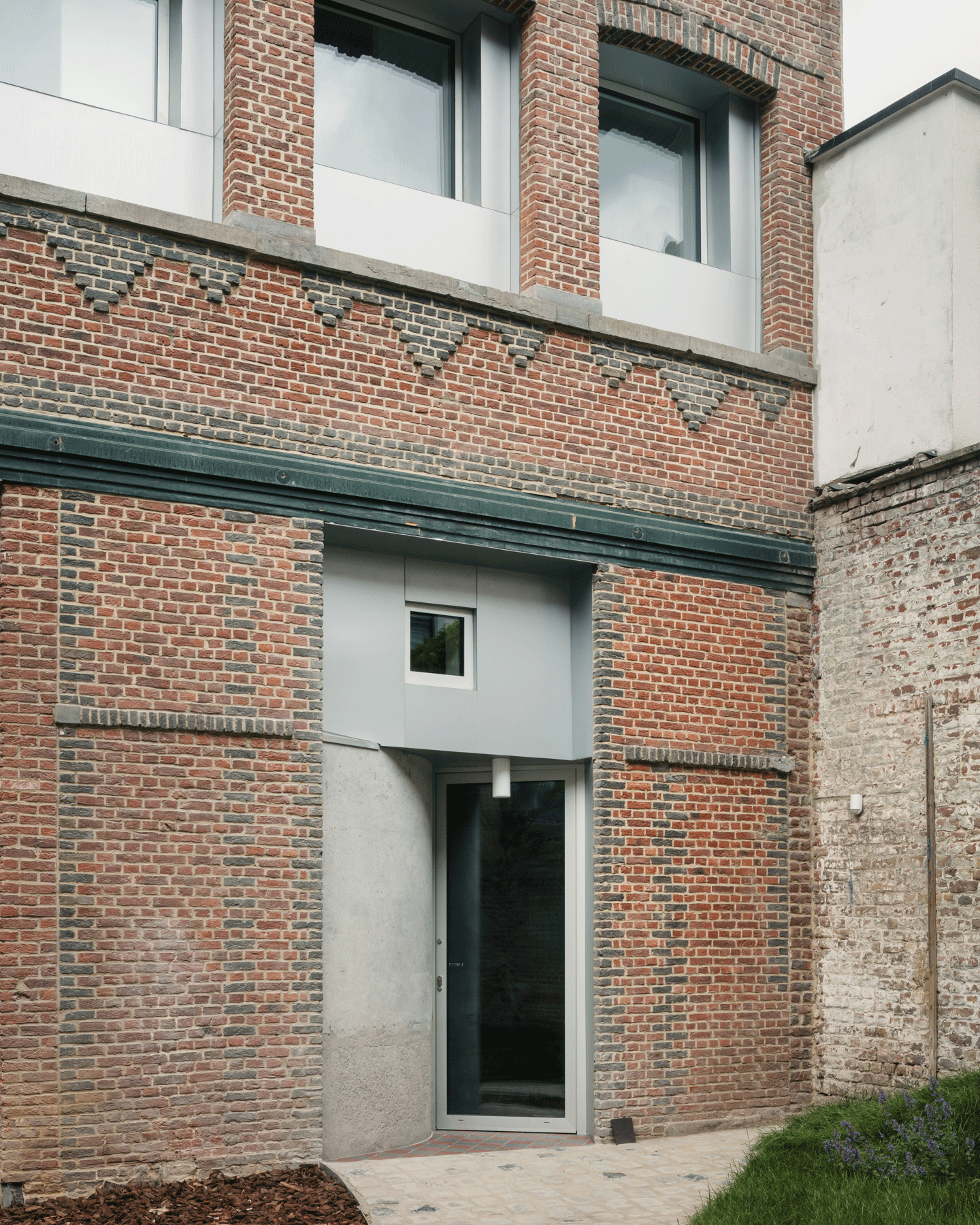 New doorway inserted into the retained brick garden façade