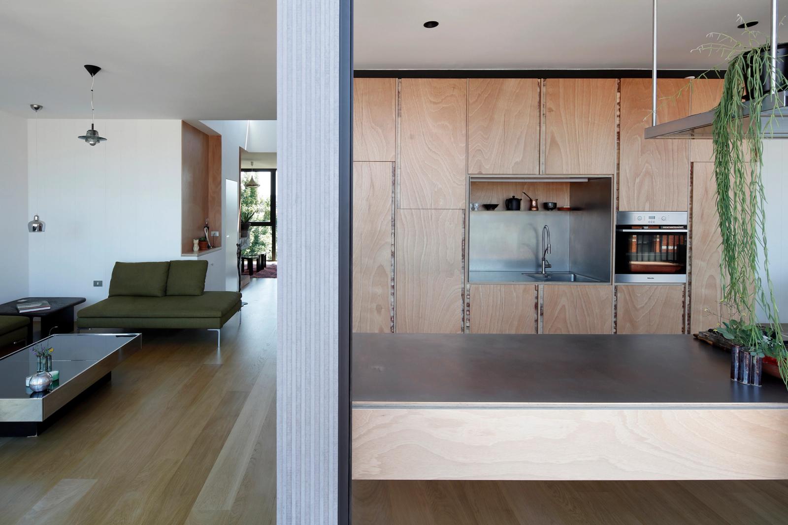 Open-plan kitchen and living room viewed from the terrace