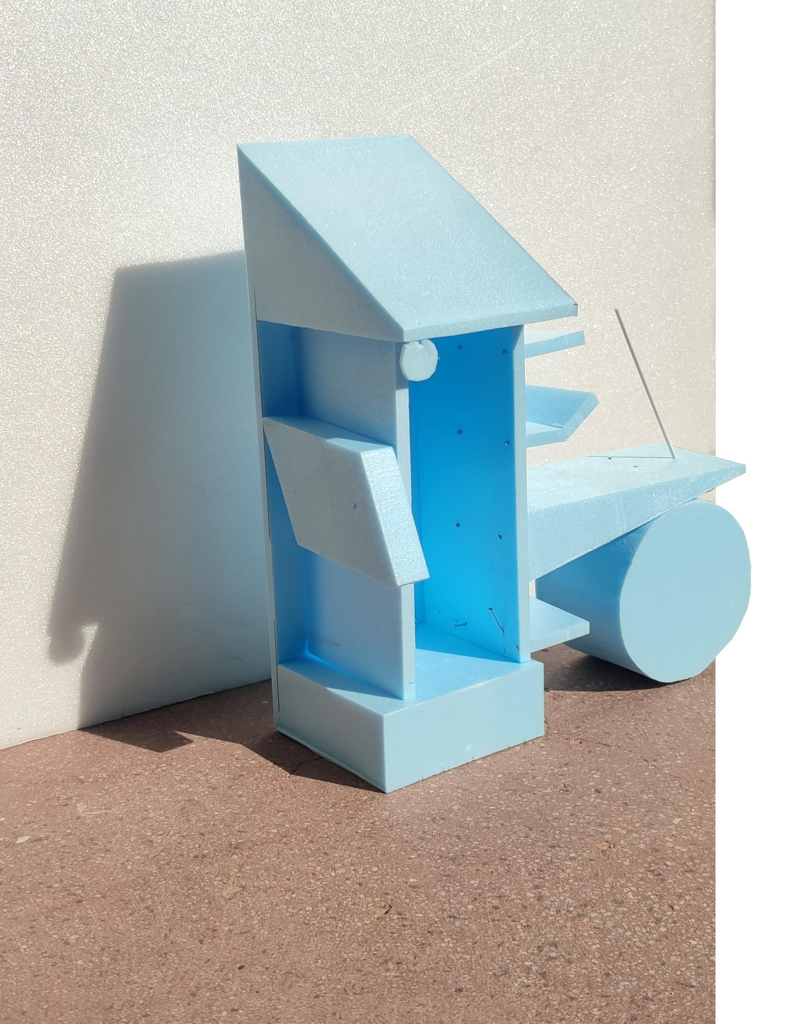 Small blue physical model of the kiosk and circular side element