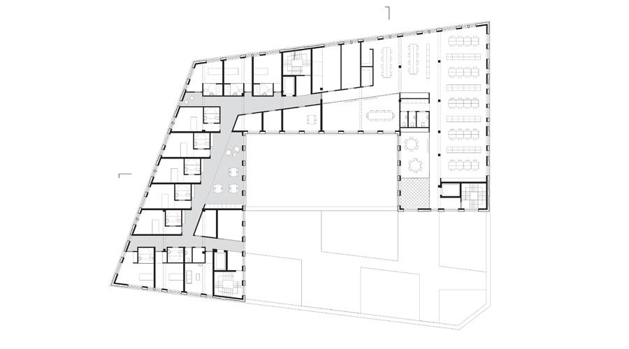 Fourth-floor plan of rooms surrounding a large central courtyard