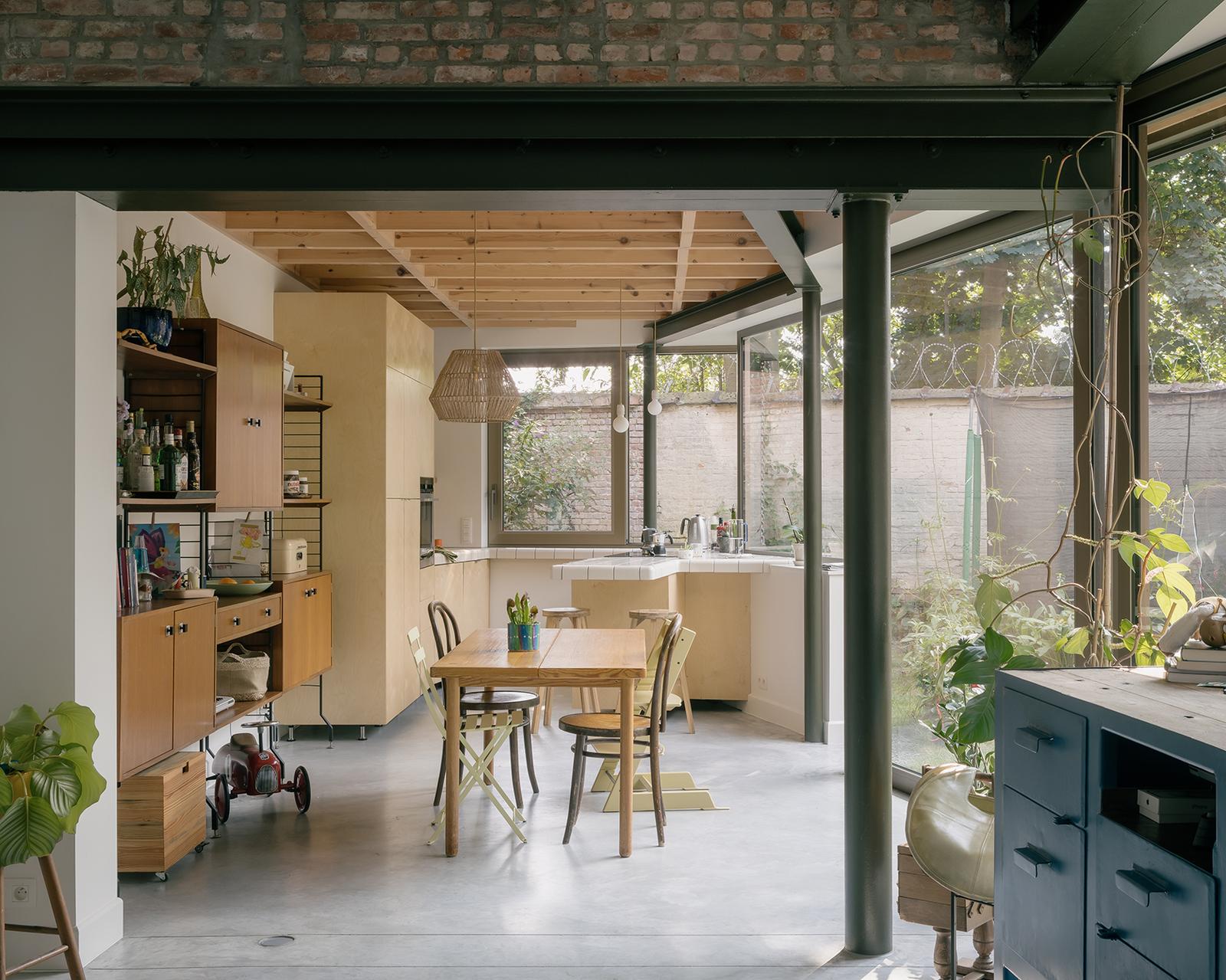Kitchen and dining area beneath an exposed timber ceiling