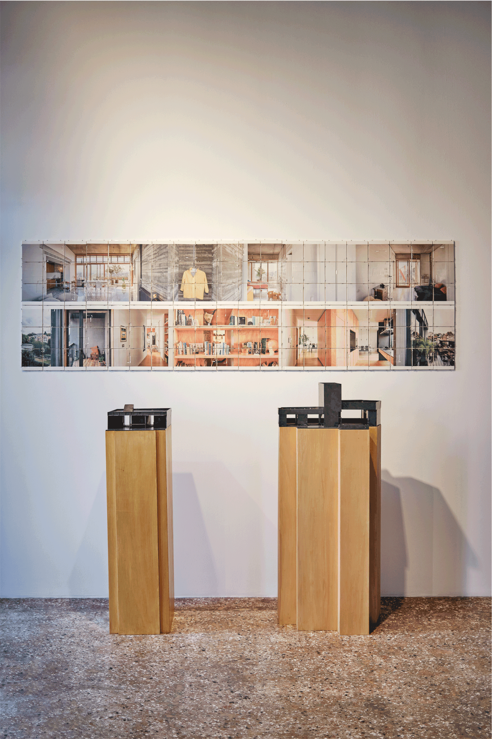 Two timber plinths and a photographic panel in the exhibition gallery