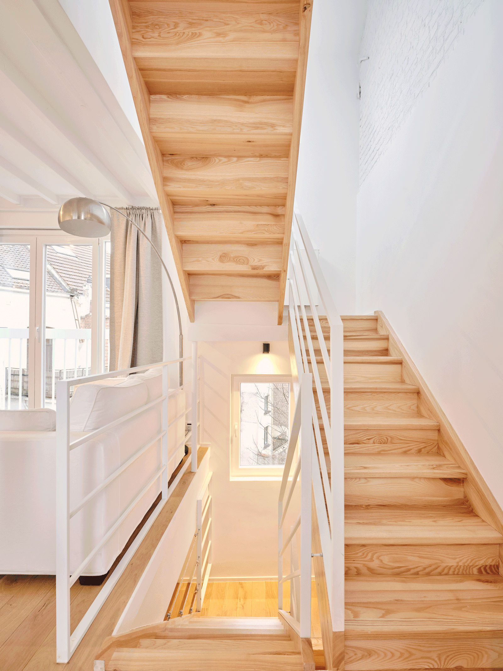 Timber stair and landing beneath the sloping roof
