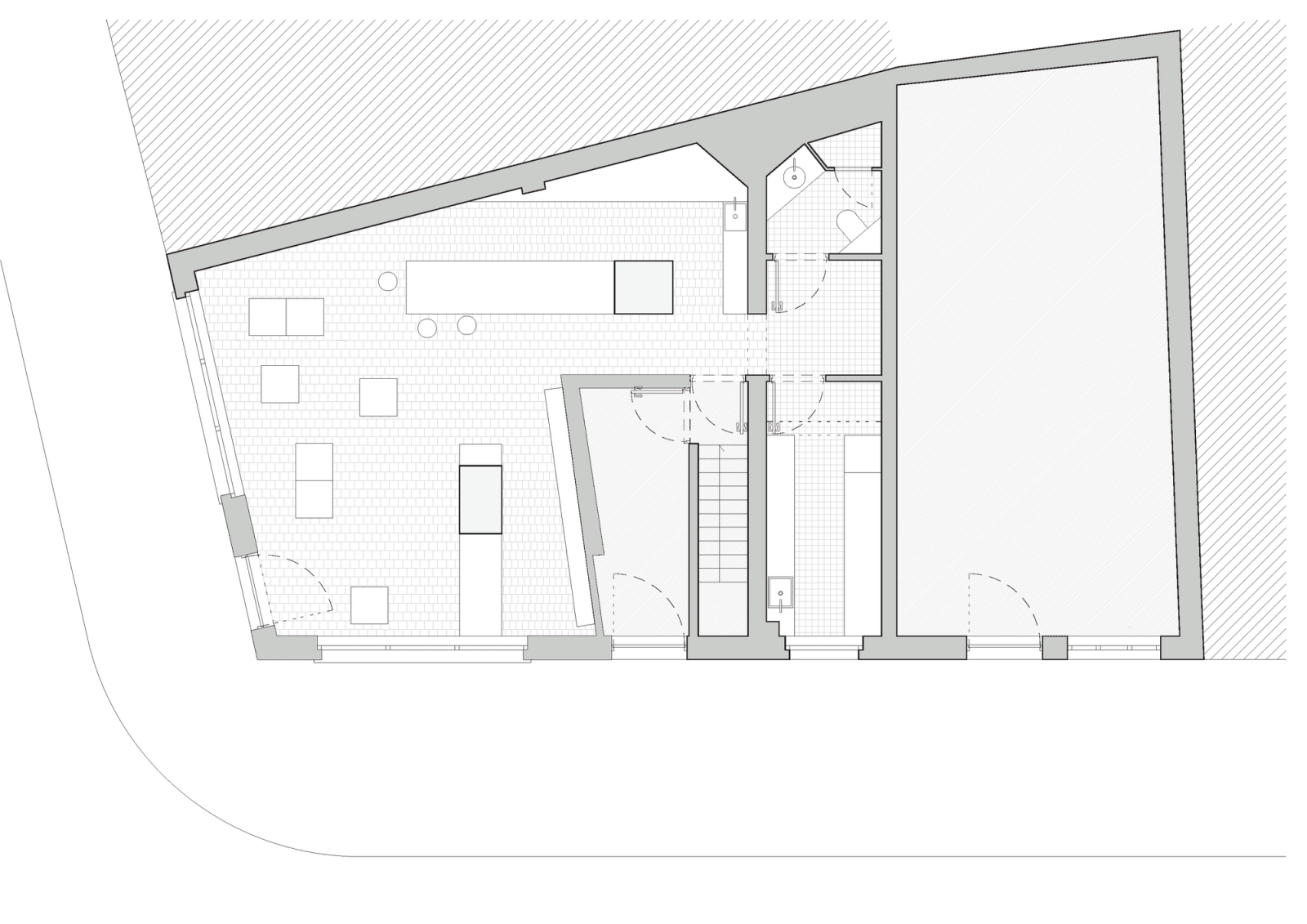 Plan of an irregular shop organized around a central service core