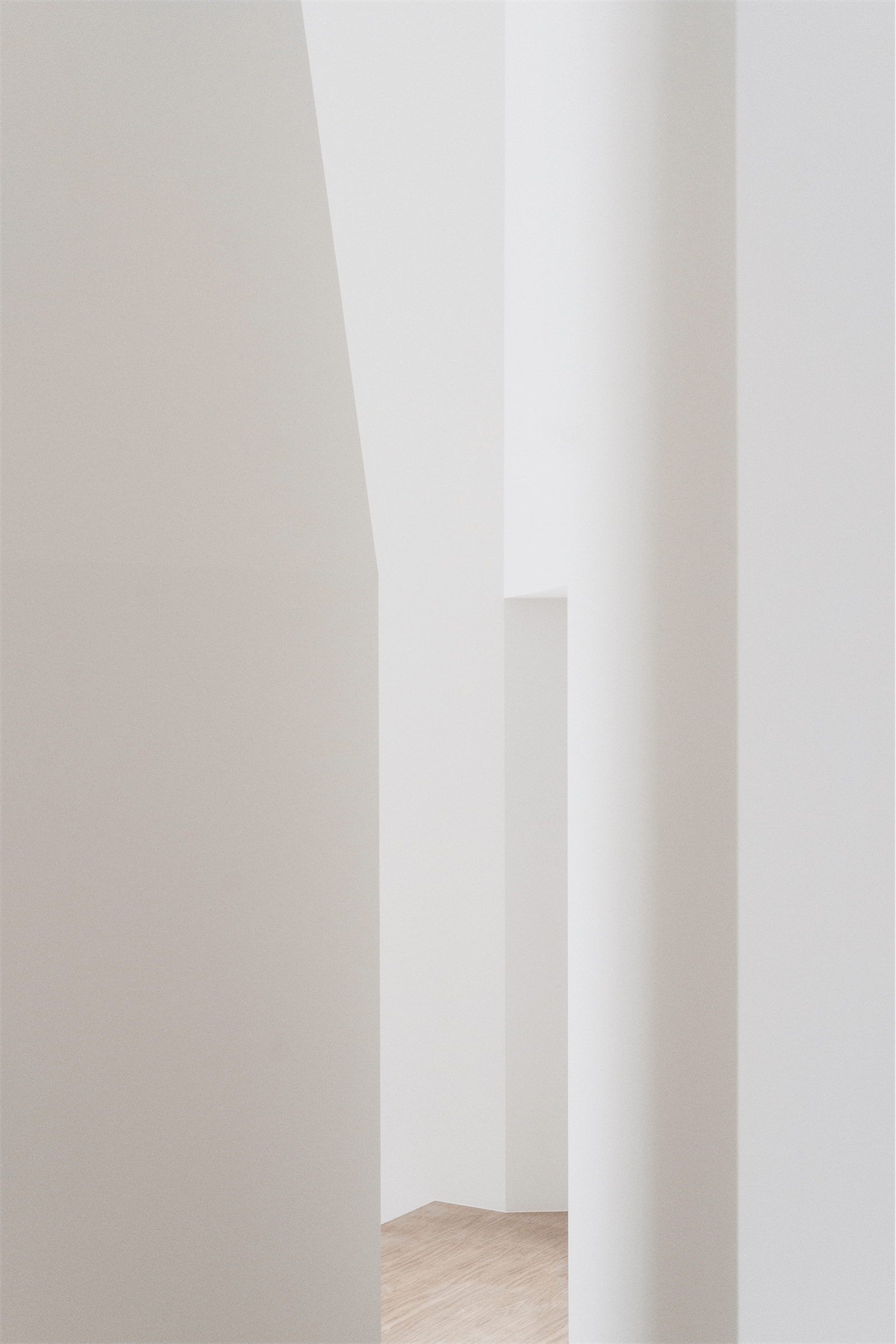 Narrow passage formed by softly curved white walls