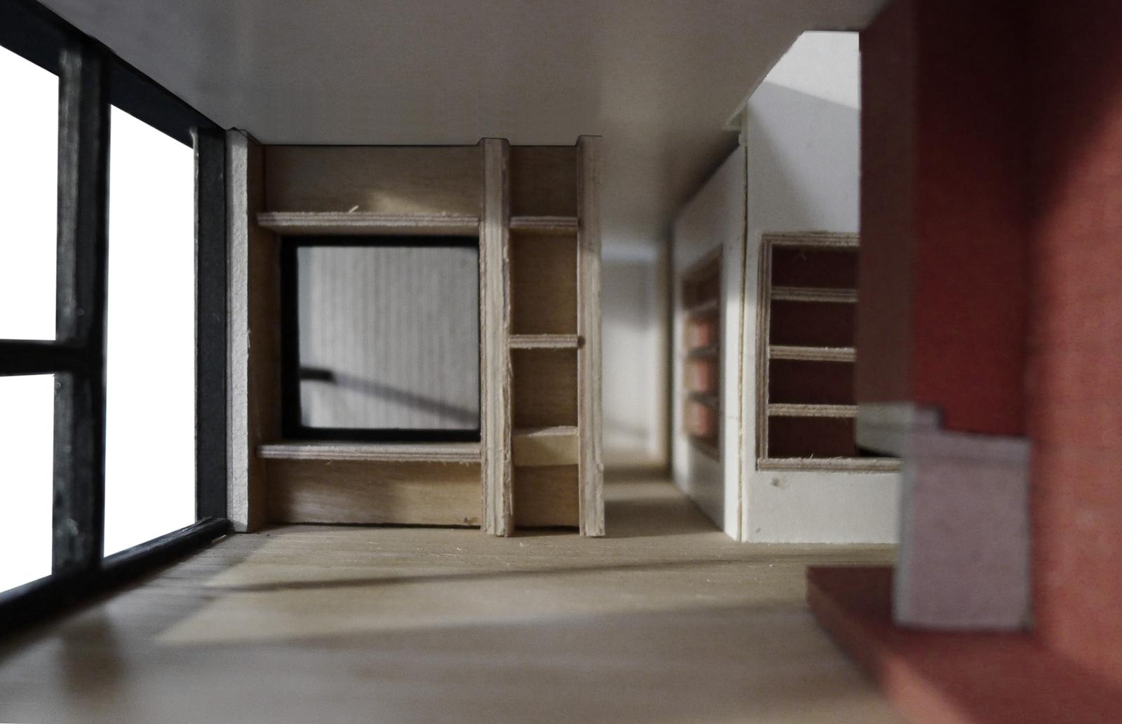 Unfinished interior showing timber frames between open rooms