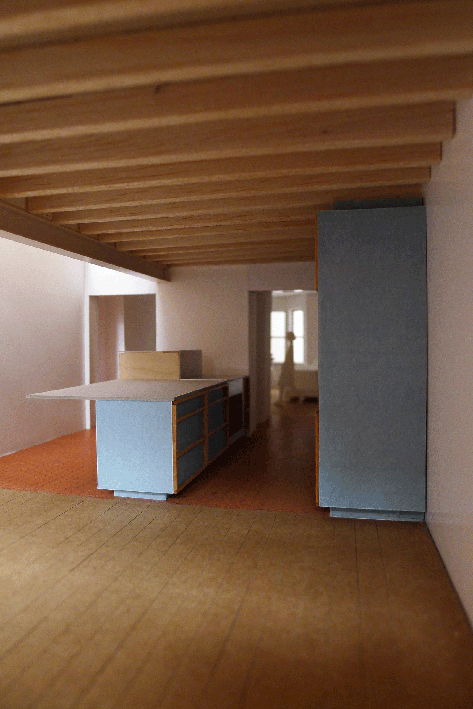 Unfinished kitchen beneath an exposed timber ceiling