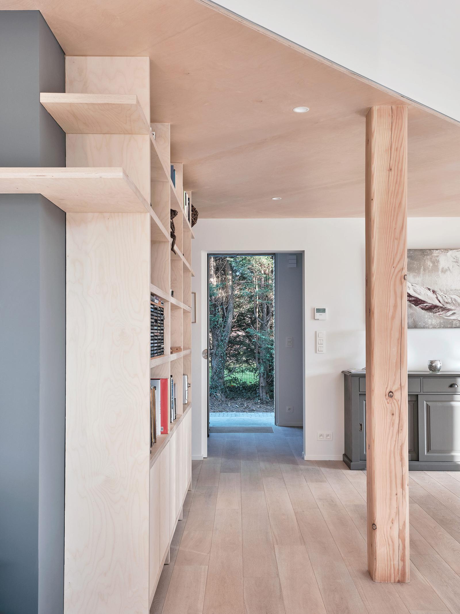 Built-in shelving and pale cabinetry lining the interior passage