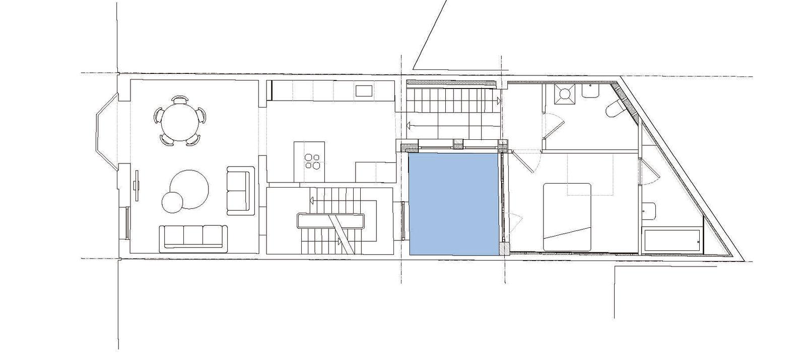Irregular house plan with the central void highlighted in blue