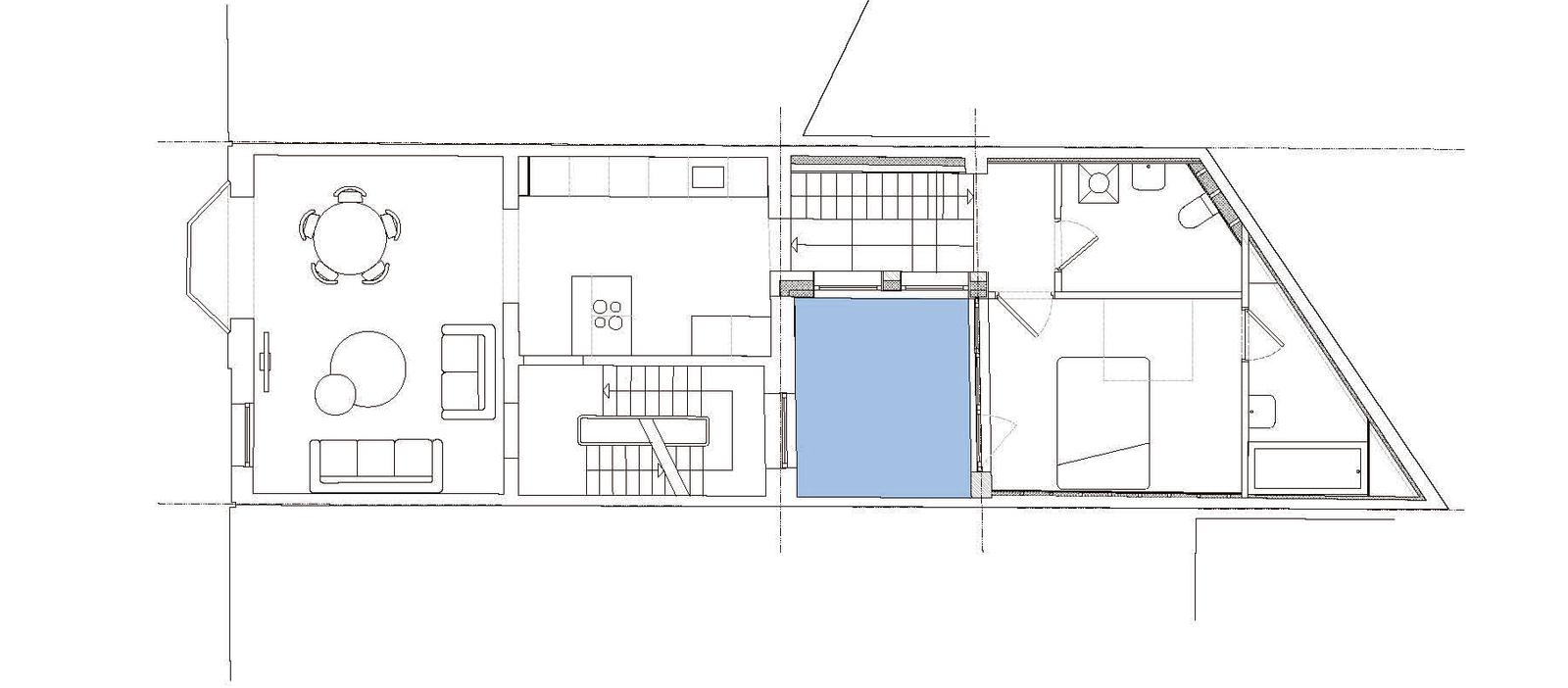 Irregular house plan with the central void highlighted in blue