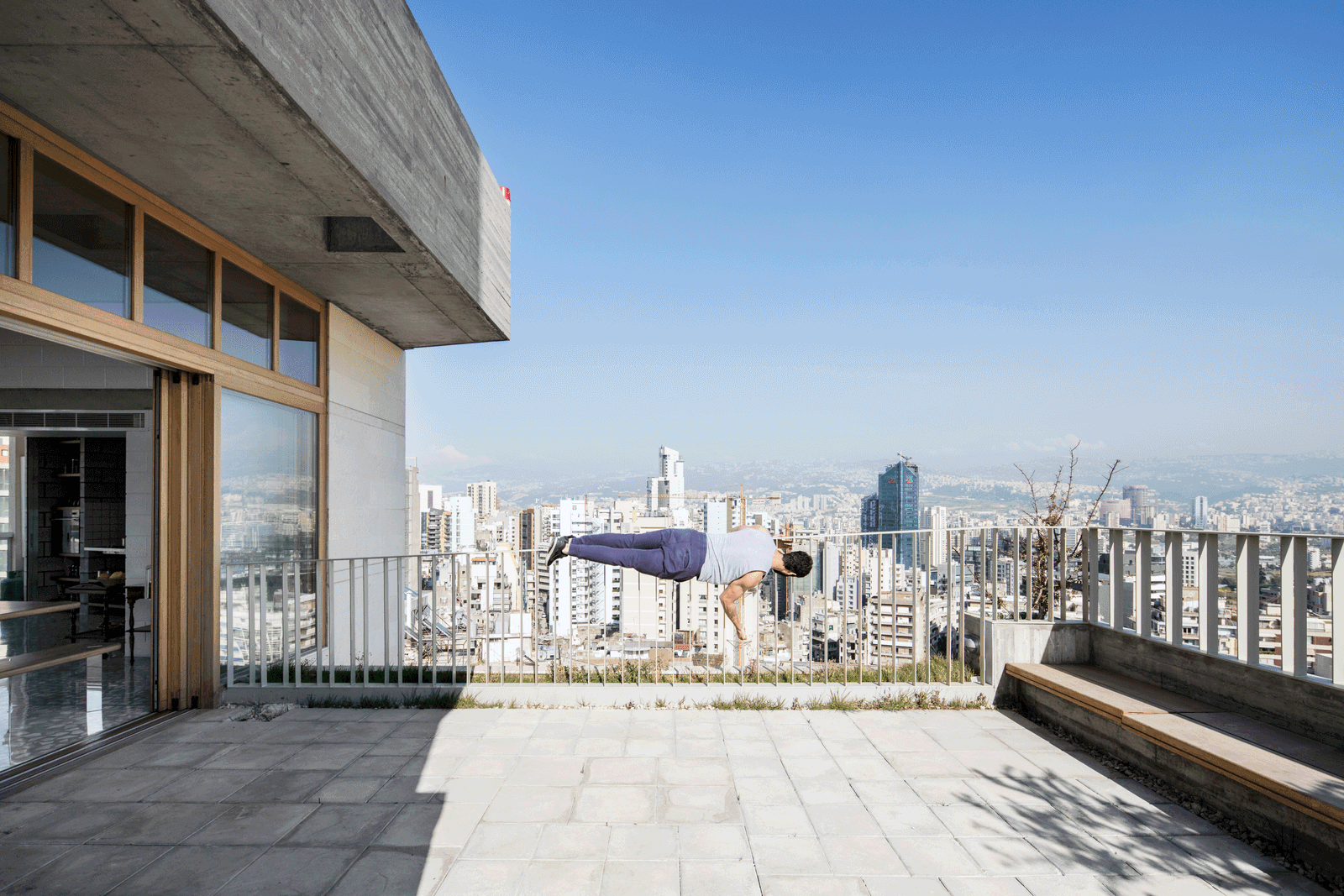 Broad roof terrace with a panoramic city and mountain view