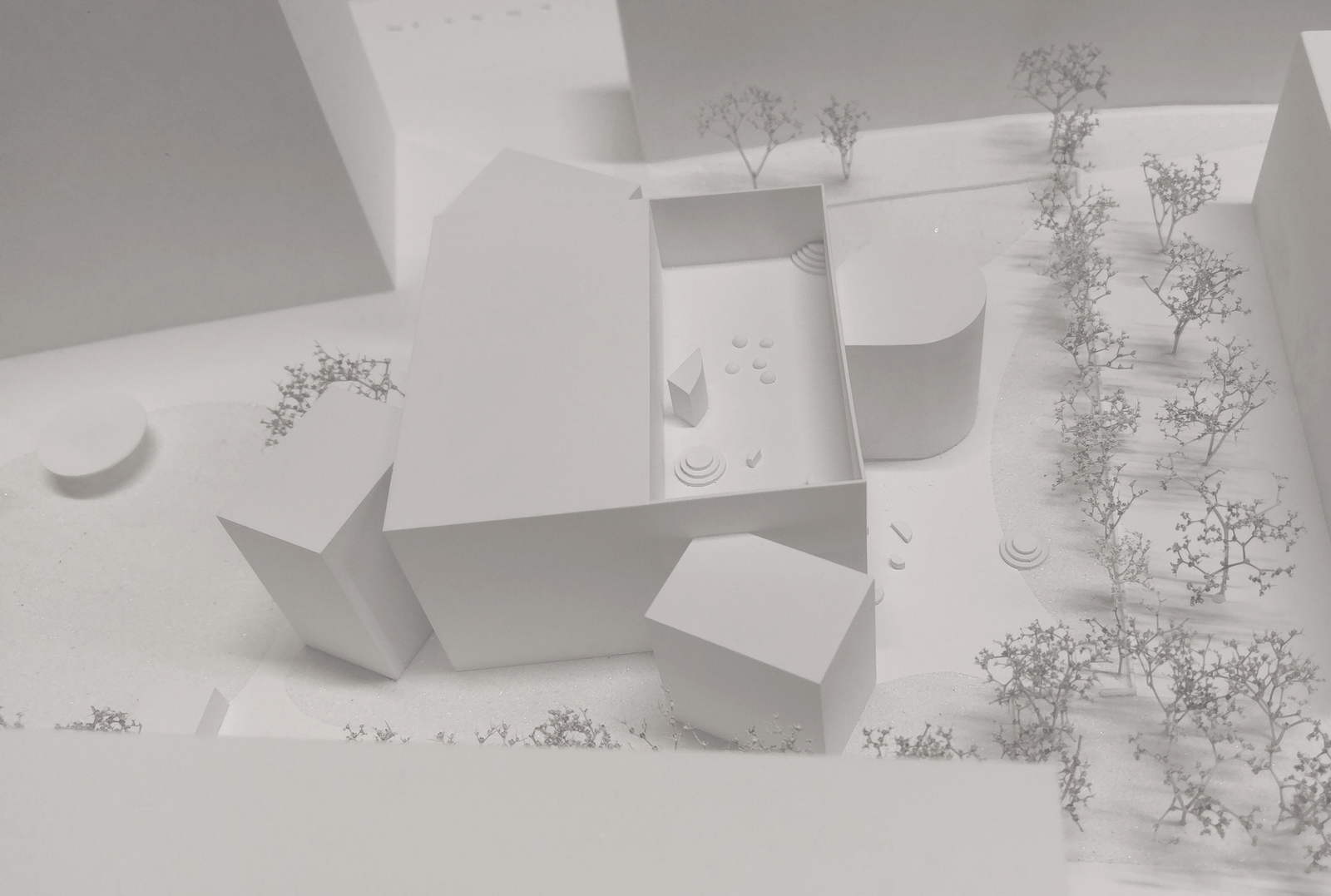 Aerial view of a physical model with clustered building volumes