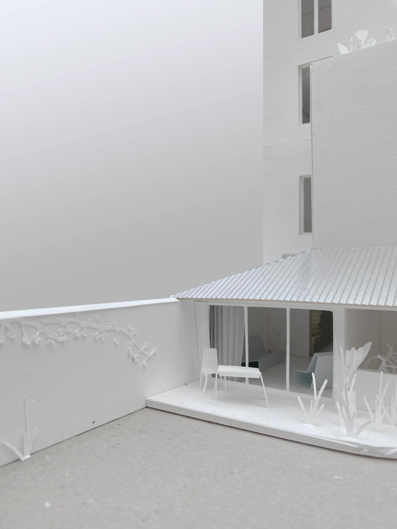 Physical model of a sheltered courtyard beneath a striped canopy