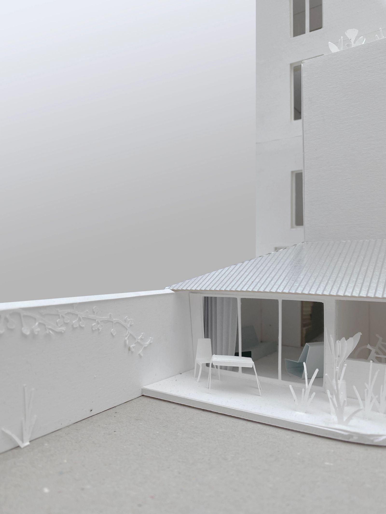 Physical model of a sheltered courtyard beneath a striped canopy