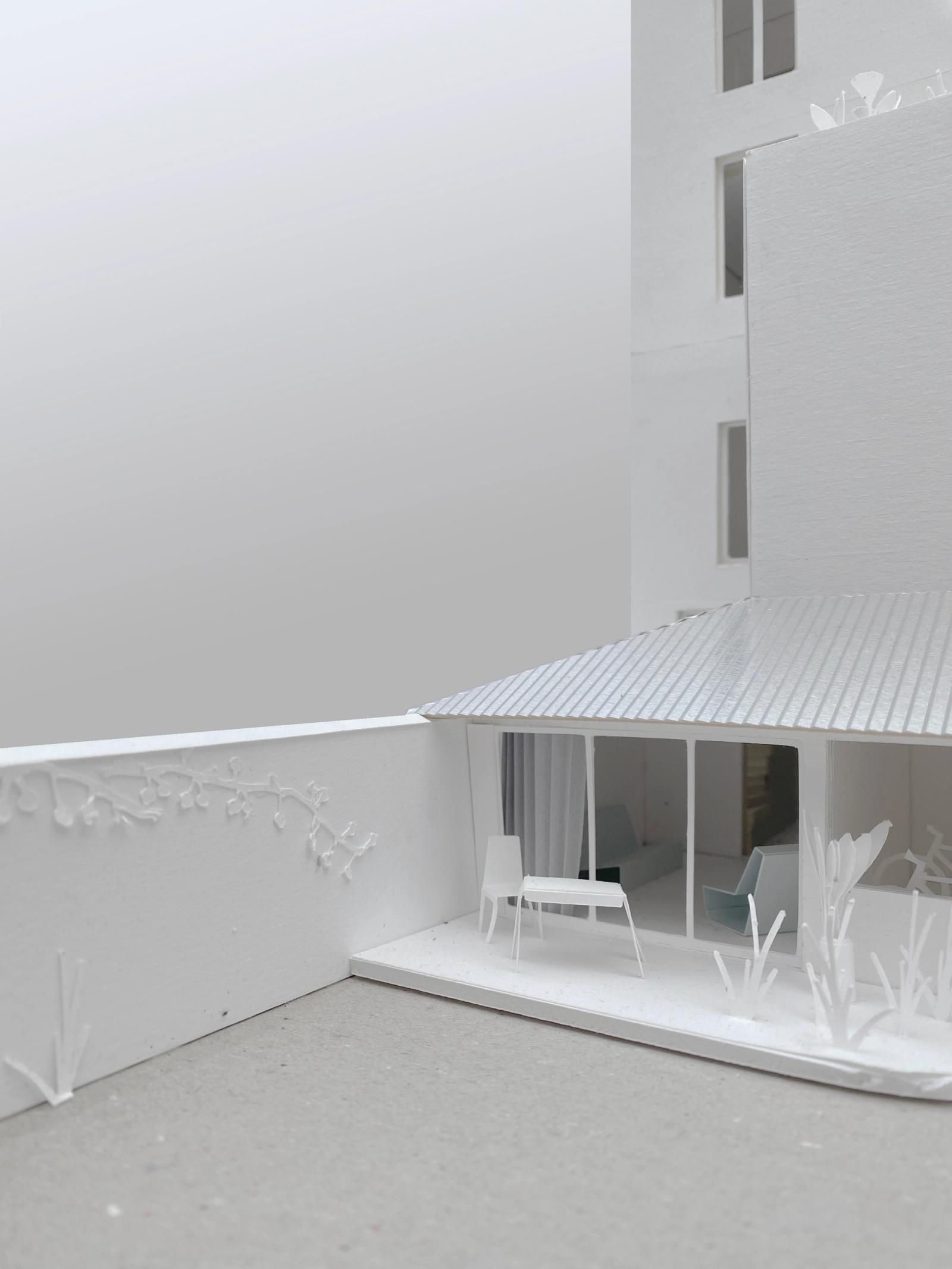 Physical model of a sheltered courtyard beneath a striped canopy