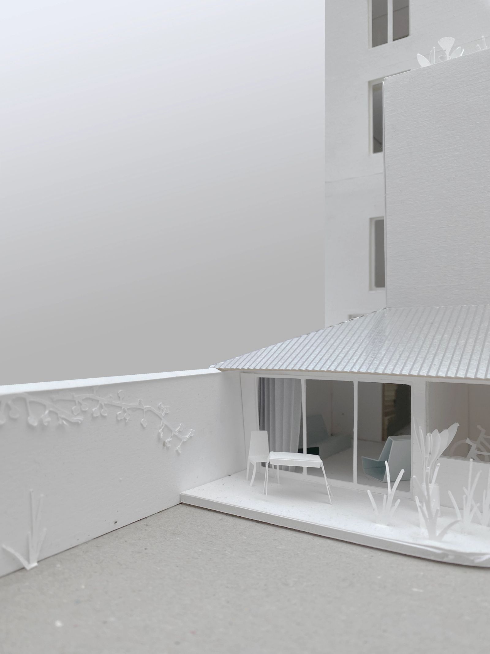 Physical model of a sheltered courtyard beneath a striped canopy